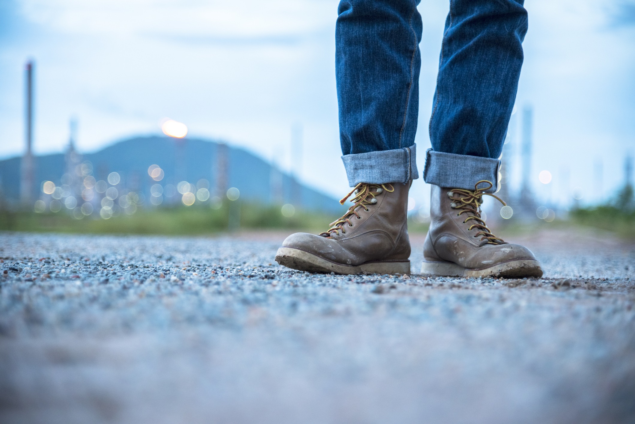 Close up of worn work boots on construction site